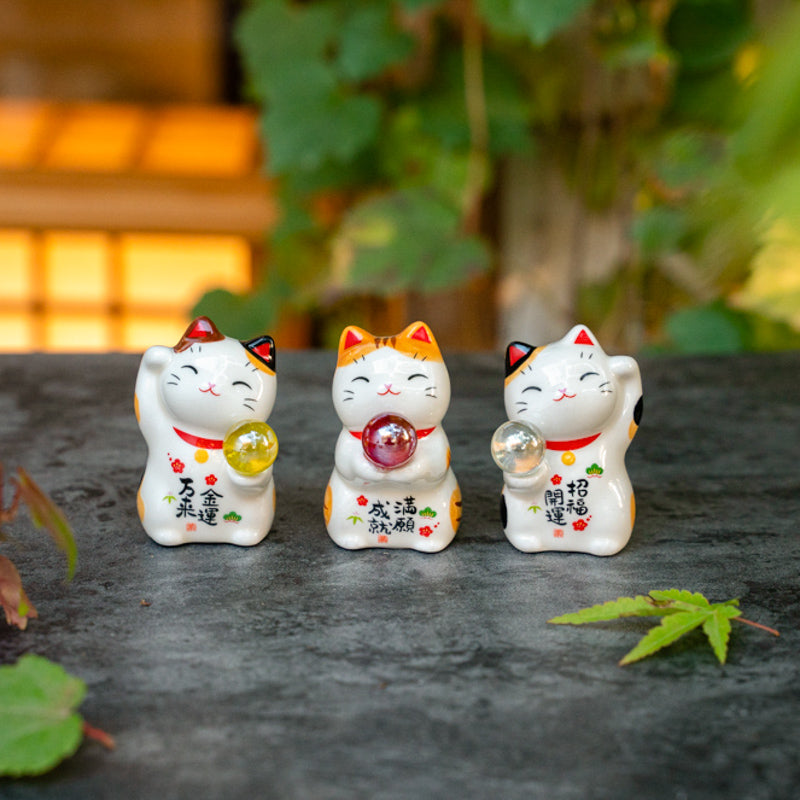 Cute Lucky Cat Holding A Glass Ball Figurine