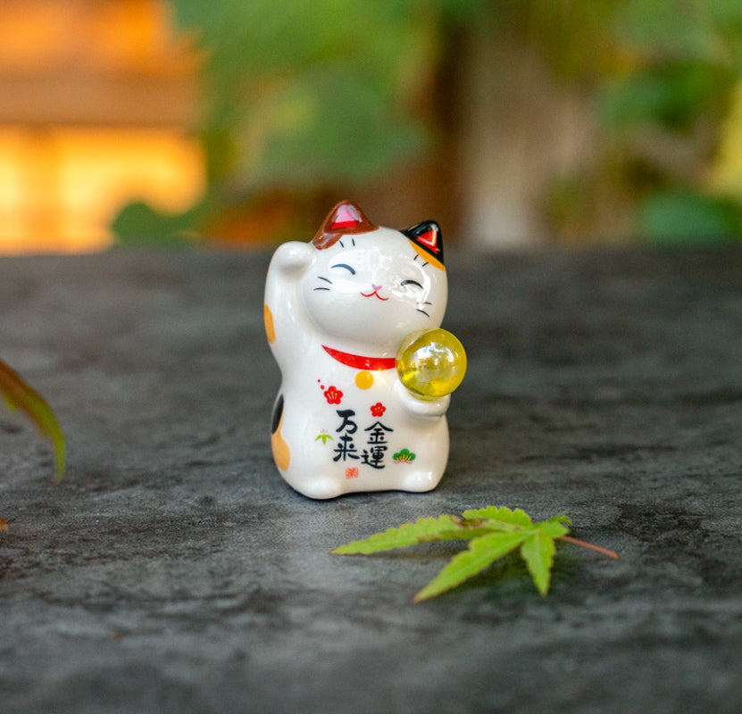 Cute Lucky Cat Holding A Glass Ball Figurine