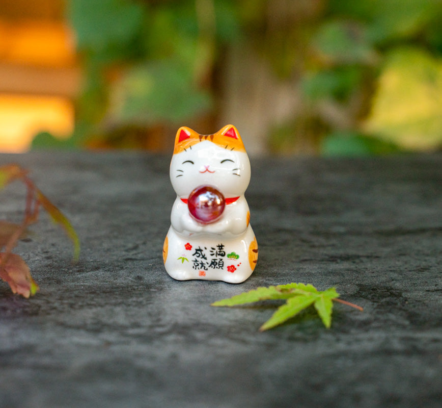 Cute Lucky Cat Holding A Glass Ball Figurine