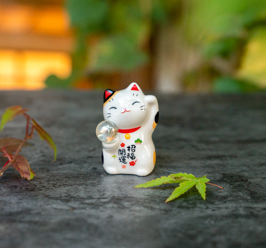 Cute Lucky Cat Holding A Glass Ball Figurine