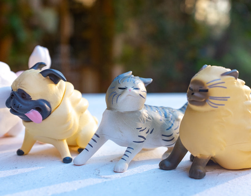 Cute Dog & Cat Under Strong Wind Figurine