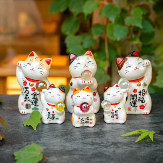 Cute Lucky Cat Holding A Glass Ball Figurine