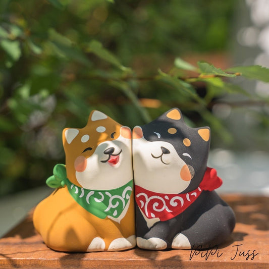 Cute Figurine Of Shibu Inu Pressing Cheeks Together