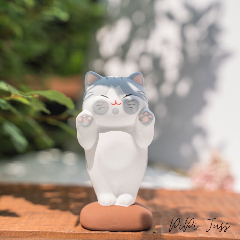 Cute Kitten Face Pressed Against The Window Figurine