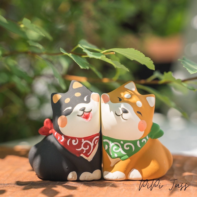 Cute Figurine Of Shibu Inu Pressing Cheeks Together