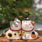 Adorable figurine of cat with their cheeks pressed together