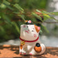 Adorable figurine of cat with their cheeks pressed together