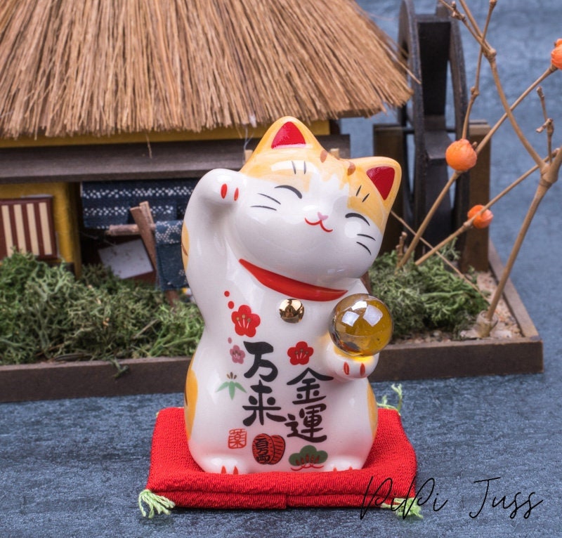 Cute Lucky Cat Holding A Glass Ball Figurine