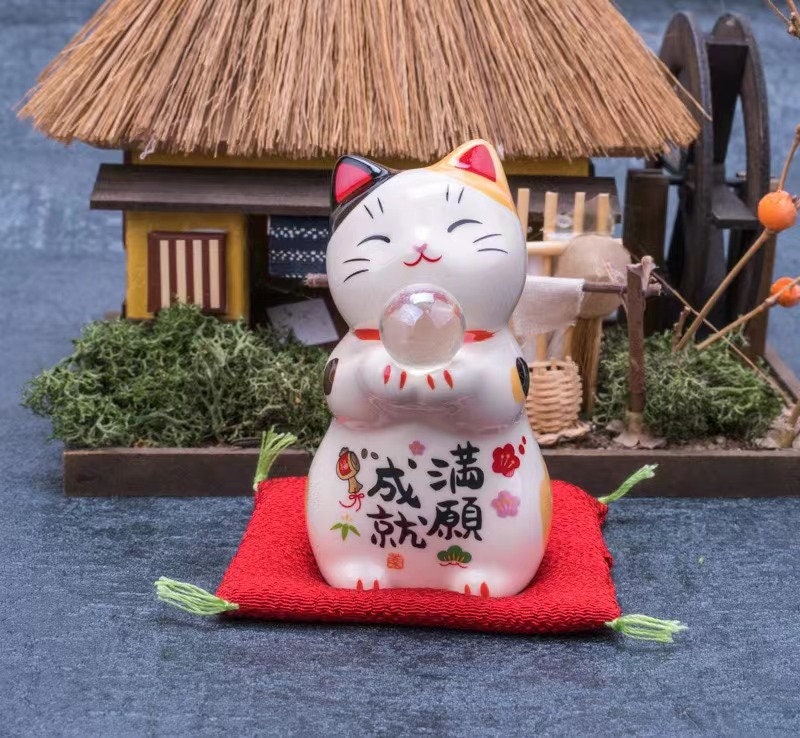 Cute Lucky Cat Holding A Glass Ball Figurine